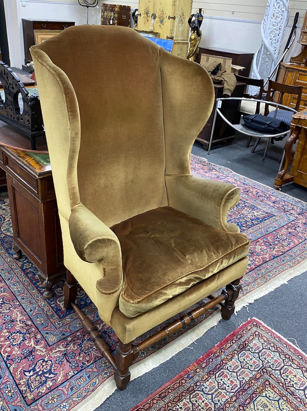 A French Louis XIV walnut wingback armchair